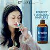 Woman using Nexon Botanics Breathe Essential Oil Synergy Blend (2 fl oz / 60 ml).