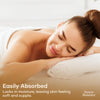 Woman resting comfortably after a massage with text highlighting fast absorption and skin-softening hydration.