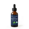 A 1 fl oz amber glass dropper bottle of Nexon Botanics Organic Peppermint essential oil on a white background.