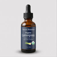 A 30 ml amber glass dropper bottle of Nexon Botanics Organic Lemongrass essential oil, featuring a dark blue label with white text and a black dropper cap, set against a light gray background.