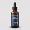 Nexon Botanics Organic Clove essential oil in a 1 fl oz amber glass dropper bottle with a dark blue label and black dropper cap, shown on a light gray background.