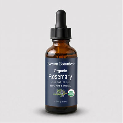 Nexon Botanics Organic Clove essential oil in a 1 fl oz amber glass dropper bottle with a dark blue label and black dropper cap, shown on a light gray background.