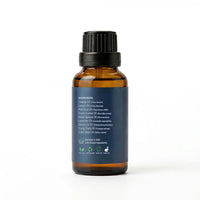 An amber glass bottle of essential oil with a black ribbed cap and a dark navy blue label showing the ingredients list, set against a plain white background.